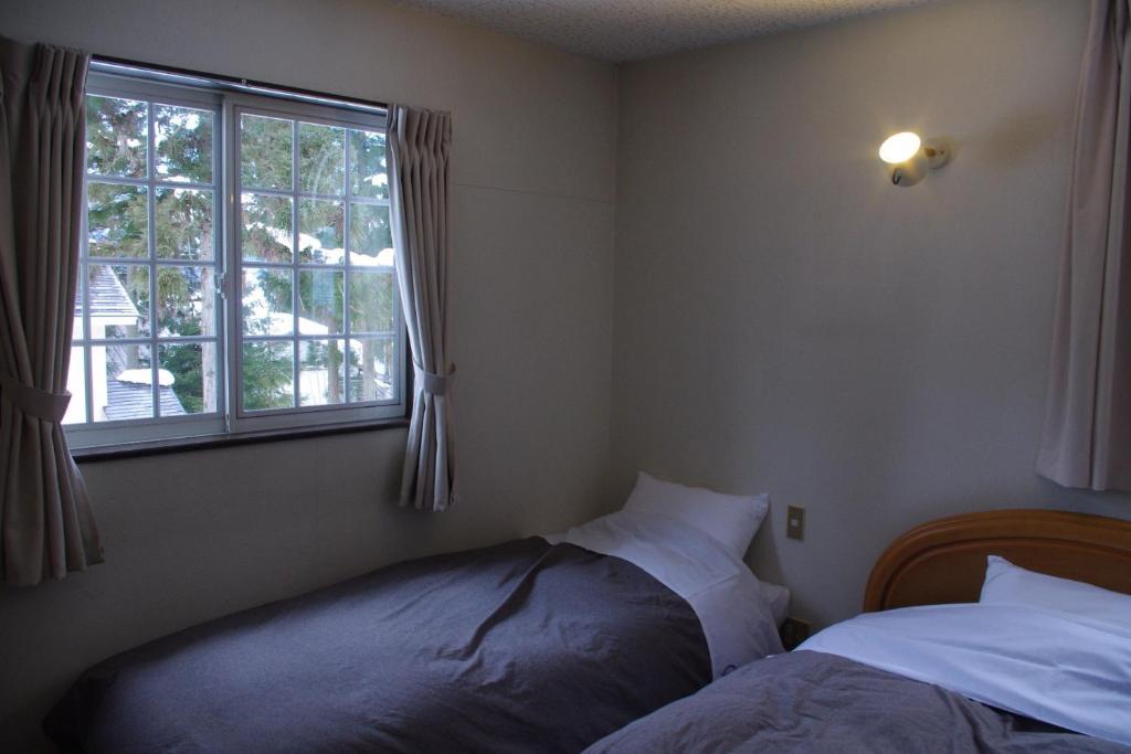Bed and Breakfast Sunny Side Hut Hakuba Zimmer foto